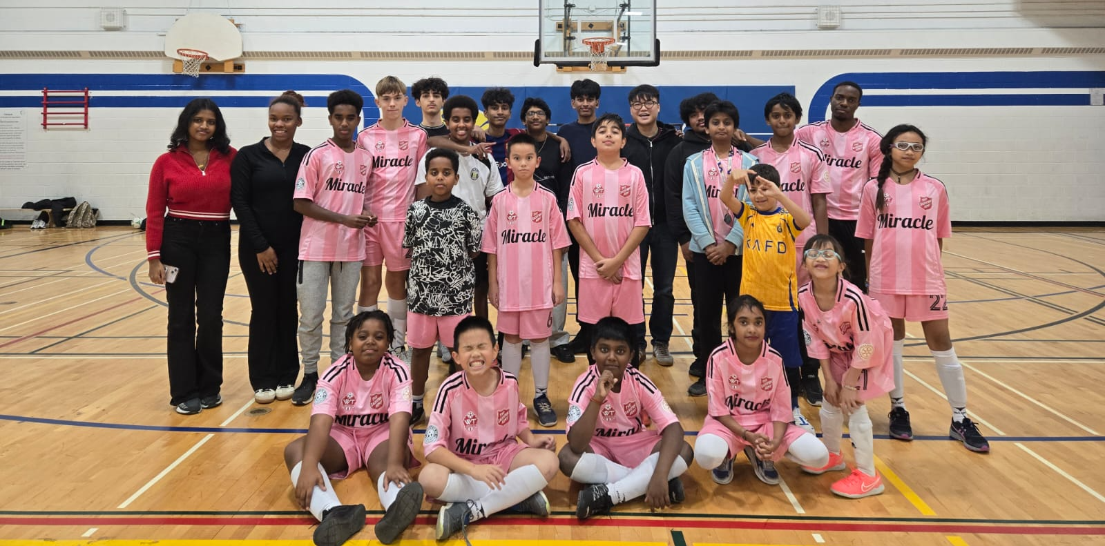 Soccer teams posing for a picture