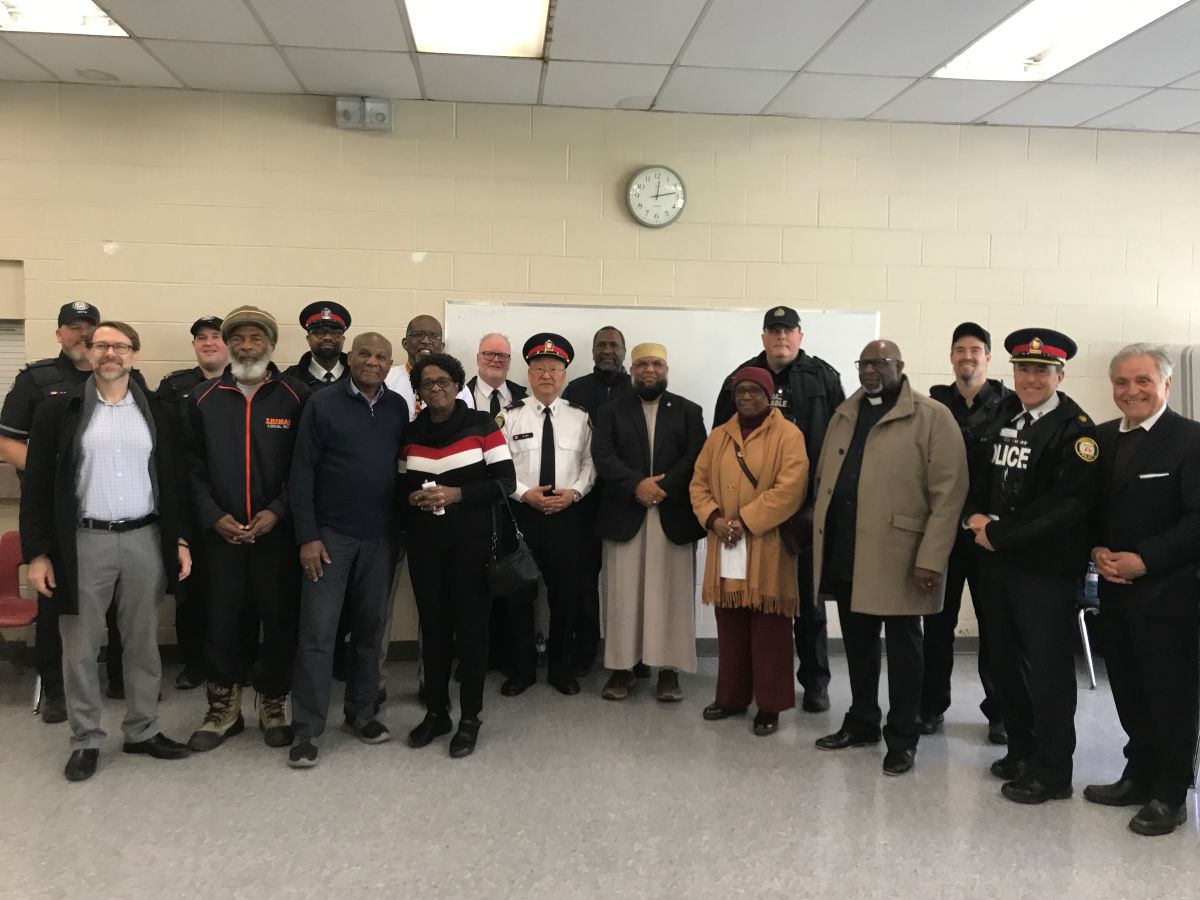 A group of faith leaders with the police officers from 31 division