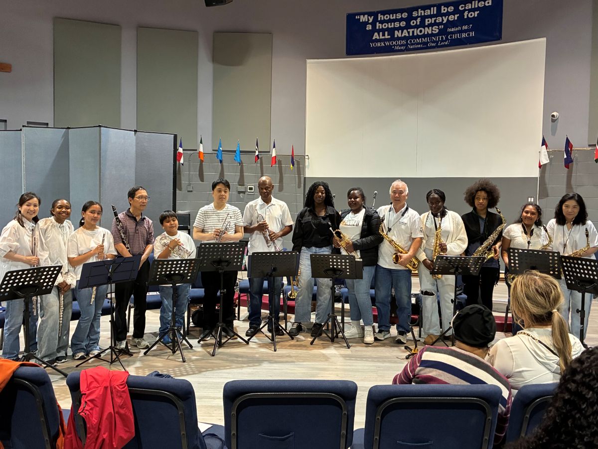 Members of the Miracle Junior Orchestra standing after their performance