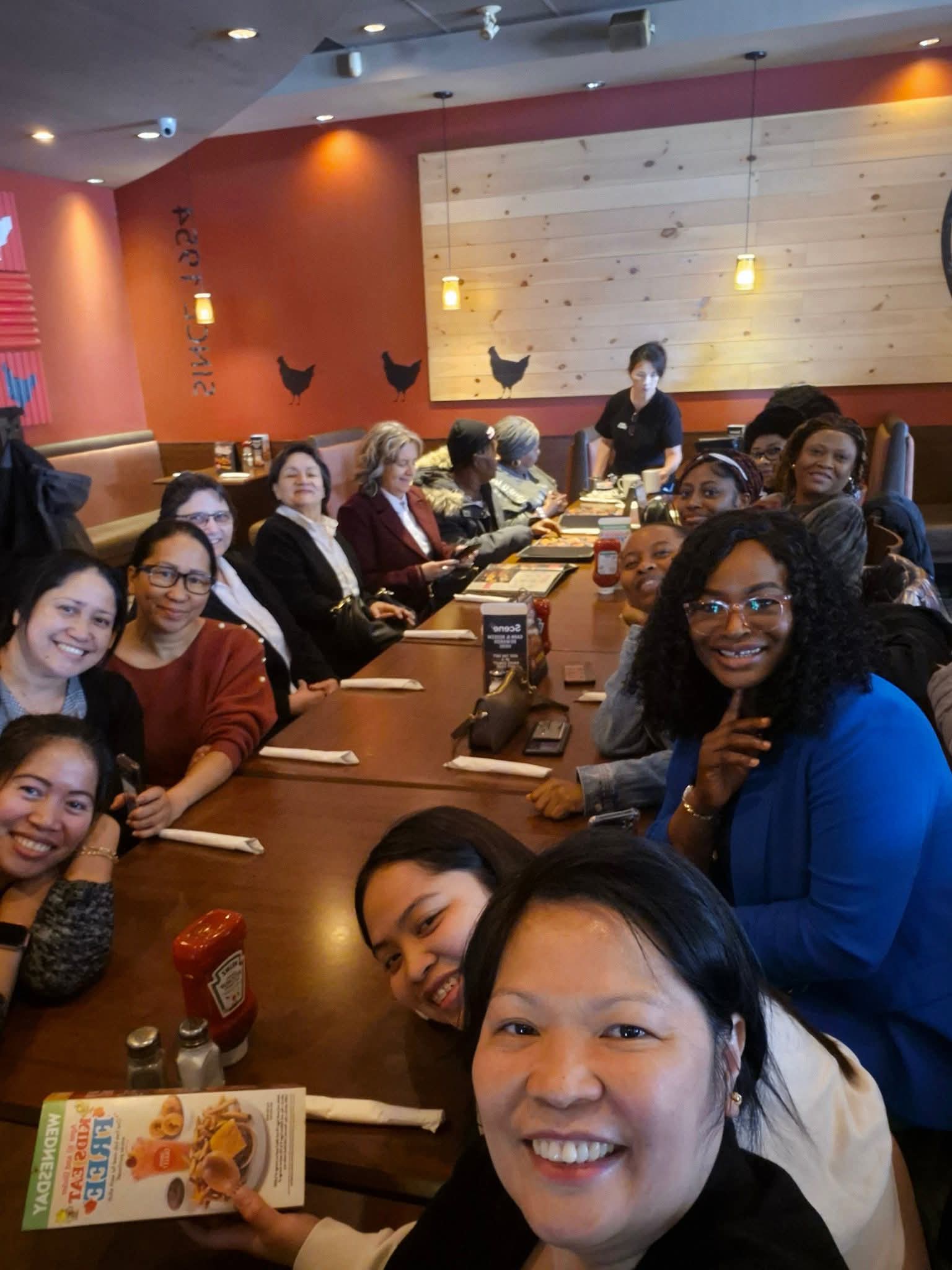 ladies from the church sitting around the table at Swiss Chalet having lunch
