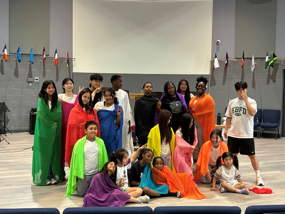 group of young people posing with costumes for a musical they were doing
